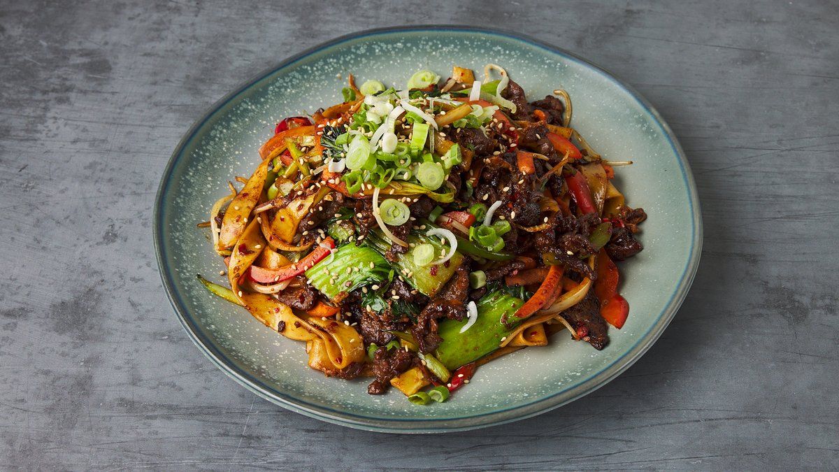 Pan fried flat noodle (fresh wheat noodle) in homemade spicy sauce